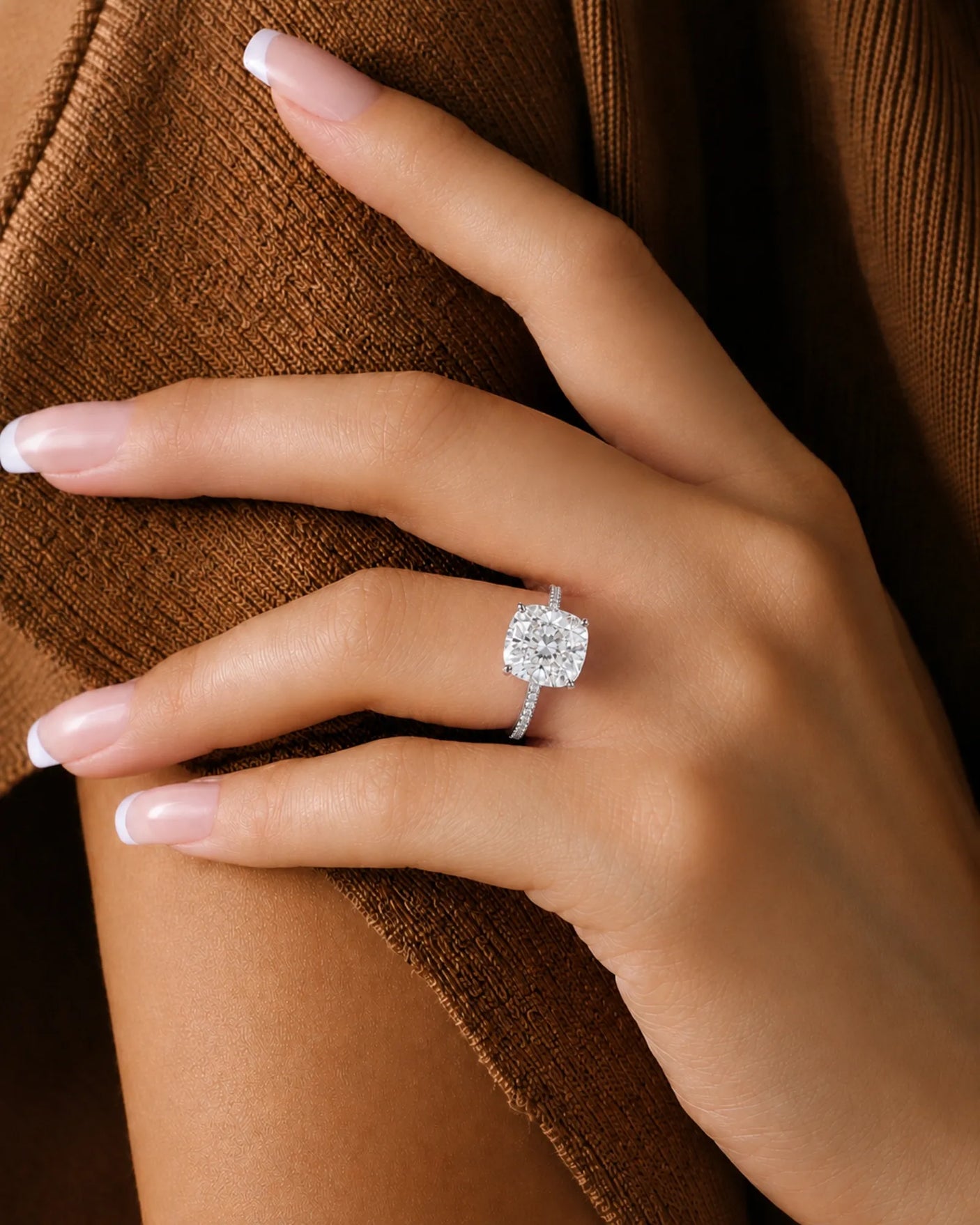 Cushion moissanite center stone ring with round side stones in white gold | SARATTI