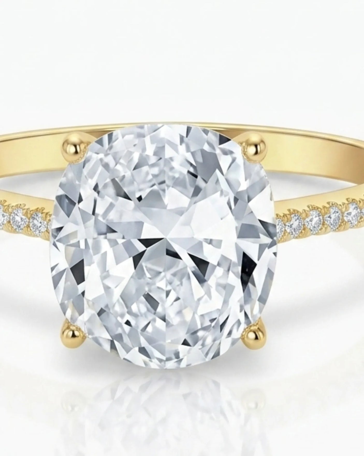 Cushion moissanite center stone ring with round side stones in yellow gold | SARATTI