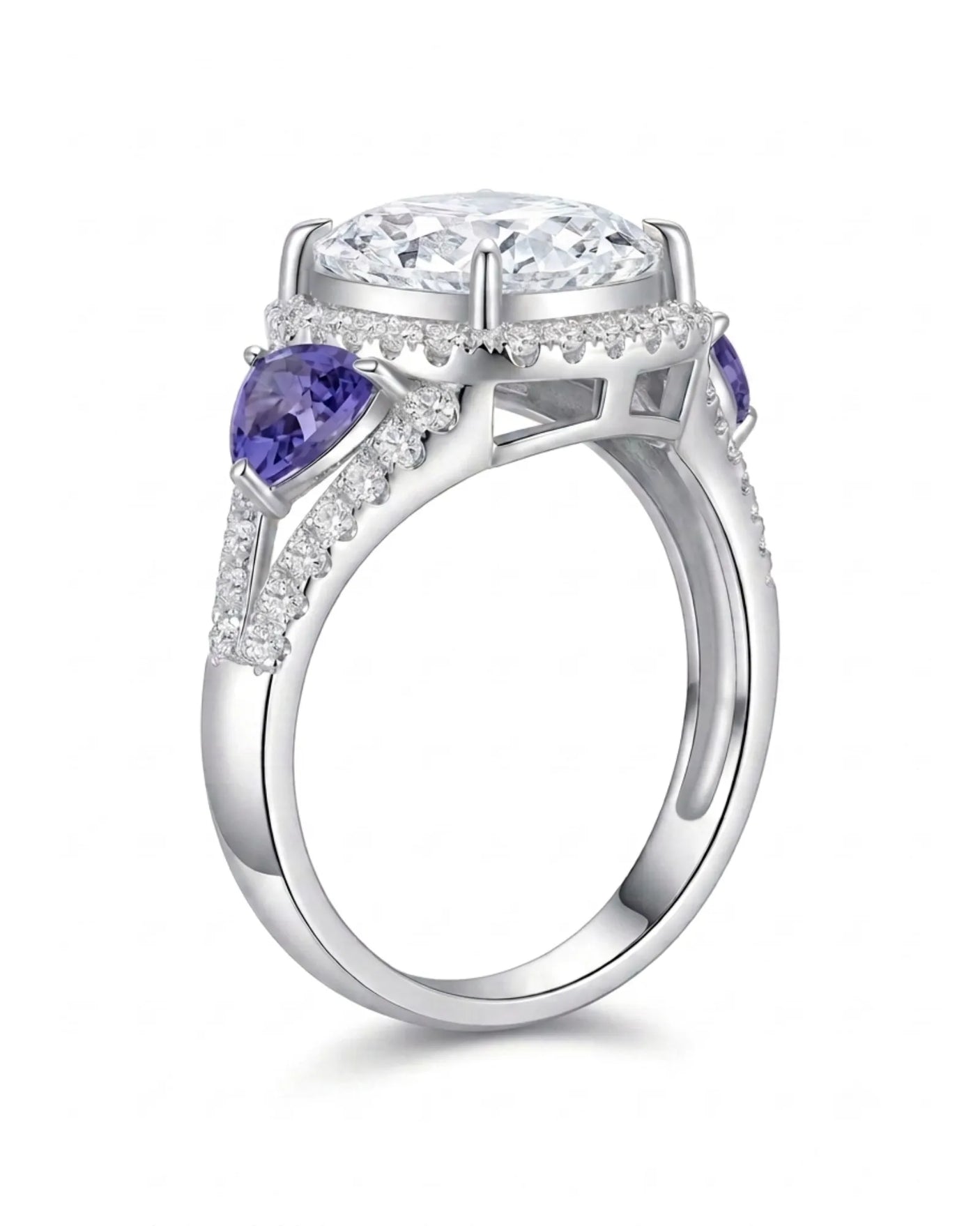 Cushion moissanite center stone ring with trillion tanzanites in platinum | SARATTI
