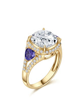 Cushion moissanite engagement ring with tanzanite side stones in yellow gold | SARATTI
