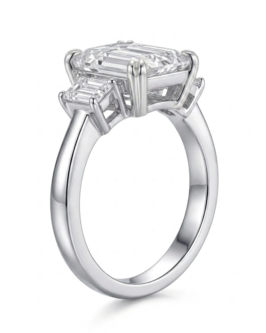 D color emerald cut moissanite center with matching side stones in enduring platinum | SARATTI
