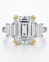 D color emerald cut moissanite center with matching side stones in two tone | SARATTI