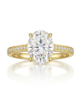 D color oval moissanite center framed by round accents in polished 18K yellow gold | SARATTI