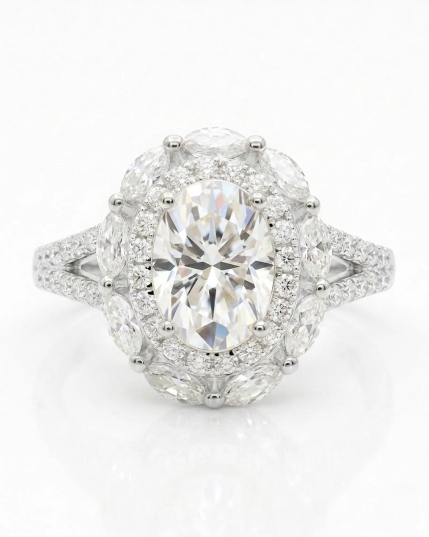 D color oval moissanite center framed by round and marquise stones in polished platinum | SARATTI