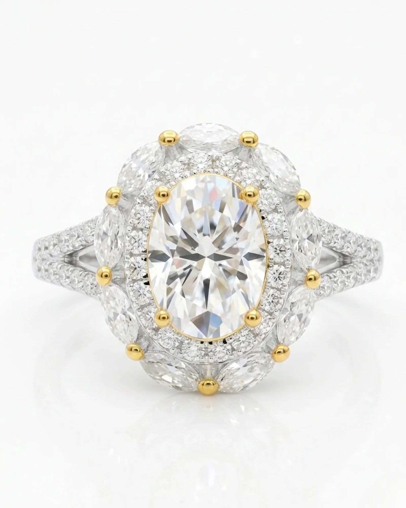 D color oval moissanite center framed by round and marquise stones in two tone | SARATTI