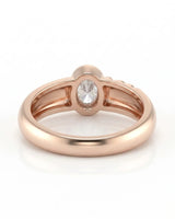 D color oval moissanite framed by a smooth bezel in softly polished 18K rose gold | SARATTI