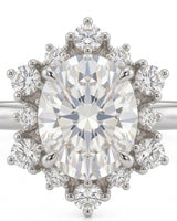 D color oval moissanite framed by round moissanite stones in enduring platinum | SARATTI