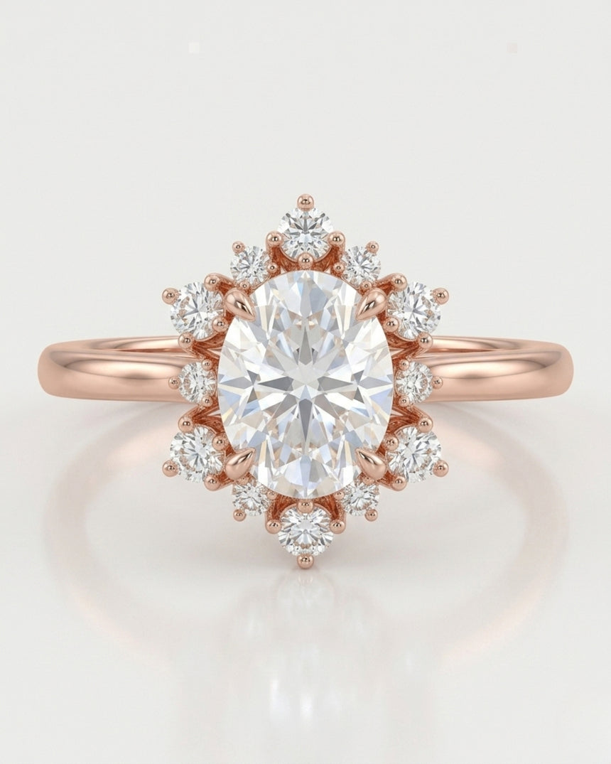 D color oval moissanite framed by round moissanite stones in polished 18K rose gold | SARATTI