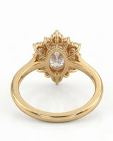D color oval moissanite framed by round moissanite stones in polished 18K yellow gold | SARATTI