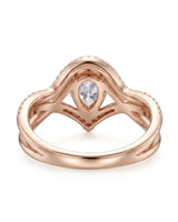 D color pear-shaped moissanite framed by round accent stones in softly polished rose gold | SARATTI