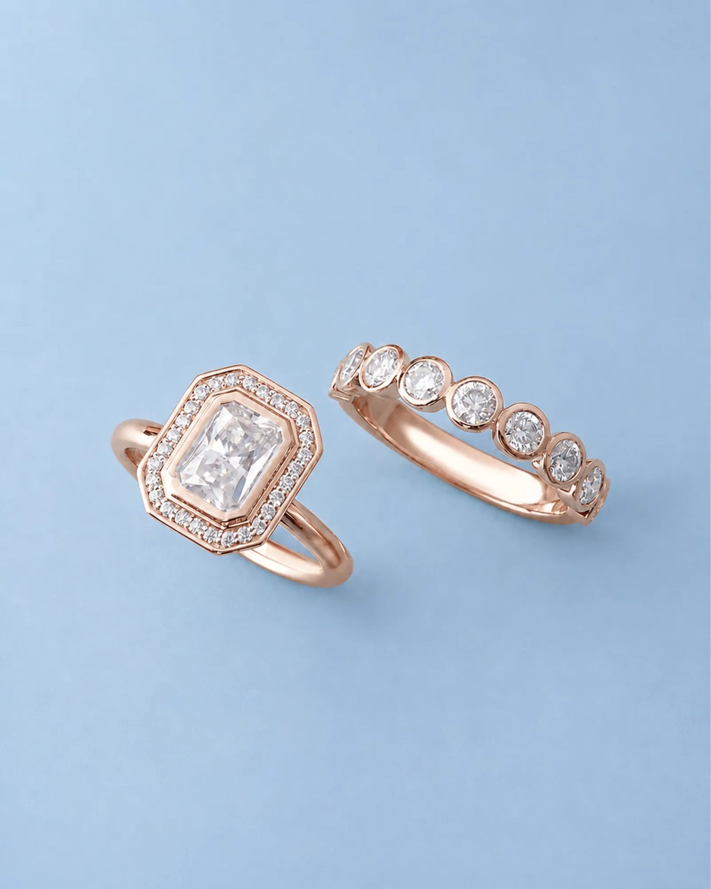 D color radiant moissanite center framed by round moissanite accents in polished 18K rose gold | SARATTI