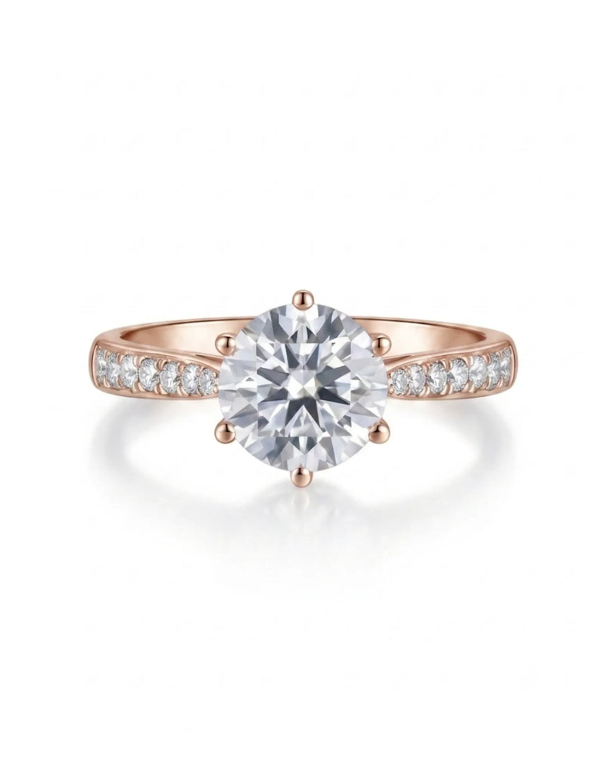 D color round moissanite center framed by pavé side stones in 18K rose gold | SARATTI