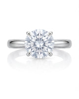D color round moissanite center with discreet pavé accents in refined 18K white gold | SARATTI