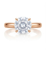 D color round moissanite center with discreet pavé accents in warm 18K rose gold | SARATTI