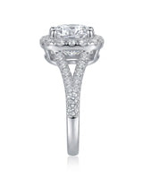 D colorless cushion moissanite framed by brilliant round stones in polished platinum | SARATTI