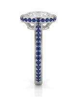D colorless oval moissanite framed by vivid blue sapphires in enduring polished platinum | SARATTI