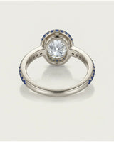D colorless oval moissanite framed by vivid blue sapphires in polished 18K yellow gold - SARATTI