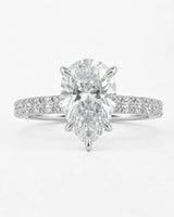 D colorless pear moissanite engagement ring with round accent stones in platinum | SARATTI