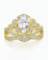 D colorless pear moissanite ring framed by round accent stones in 18K yellow gold | SARATTI