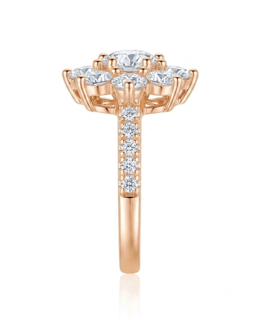 D colorless round moissanite ring framed by brilliant cluster stones in 18K rose gold | SARATTI