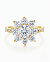 D colorless round moissanite ring framed by brilliant cluster stones in 18K yellow gold | SARATTI