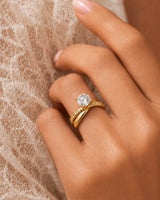 D colorless round moissanite ring with brilliant side stones set in 18K yellow gold | SARATTI