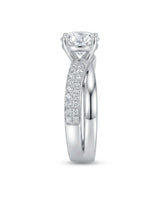D colorless round moissanite ring with brilliant side stones set in enduring platinum | SARATTI