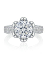 D colorless round moissanite ring with hidden halo and pavé side stones in platinum | SARATTI