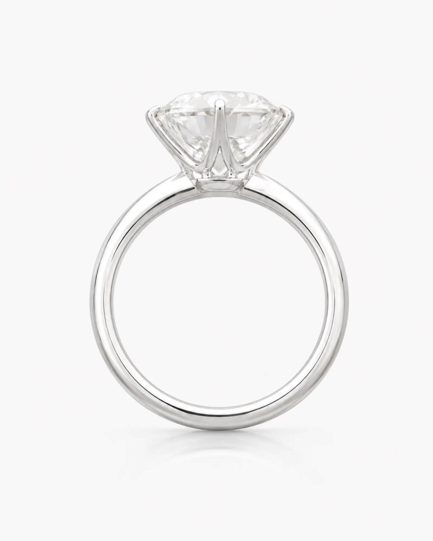 D colorless round moissanite secured in a precise six-prong platinum setting | SARATTI