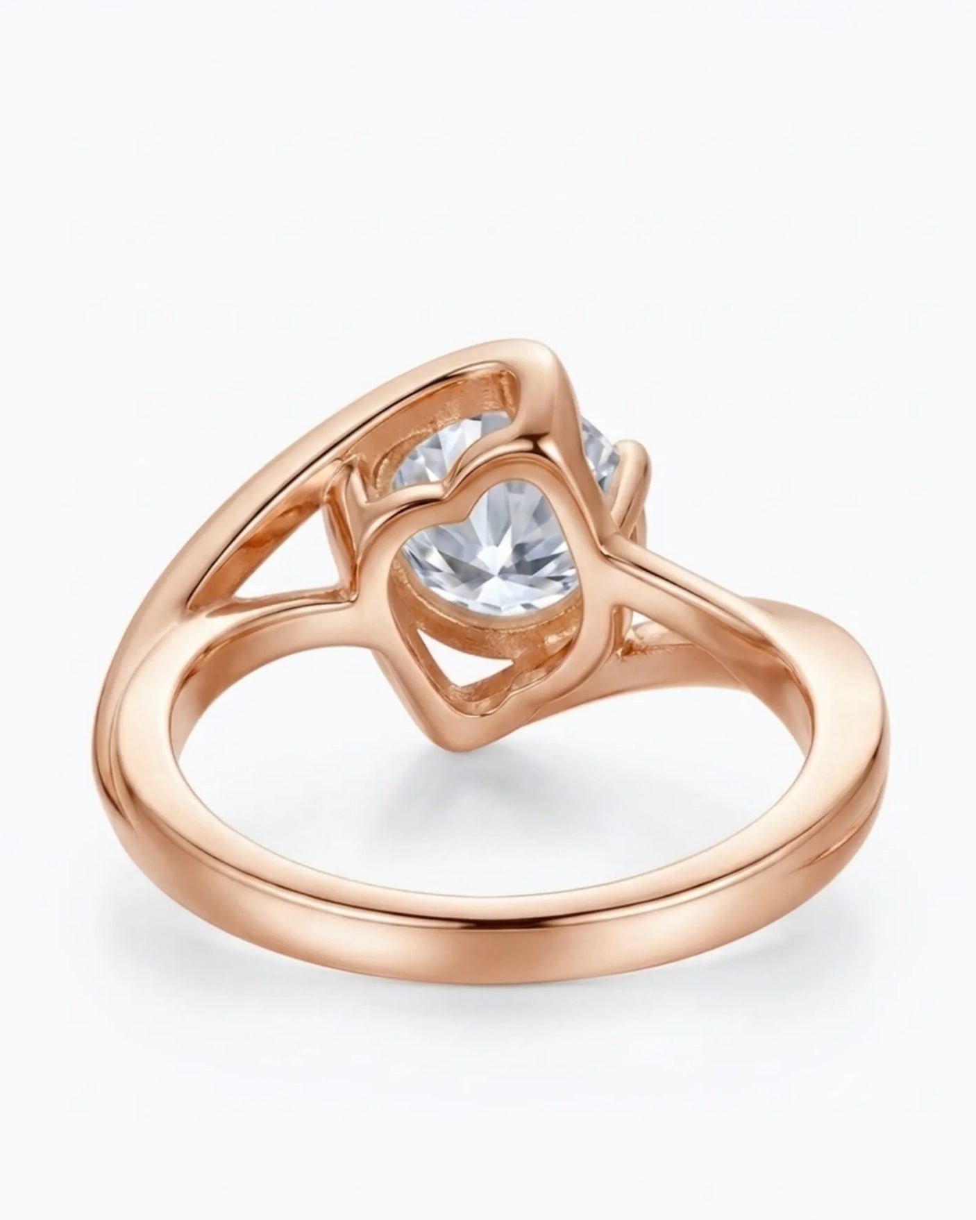 D colorless round moissanite solitaire held within a polished 18K rose gold setting | SARATTI