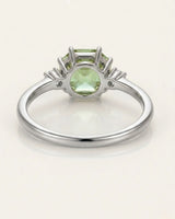 Dainty green tourmaline engagement ring with two diamonds in 18K white gold | SARATTI