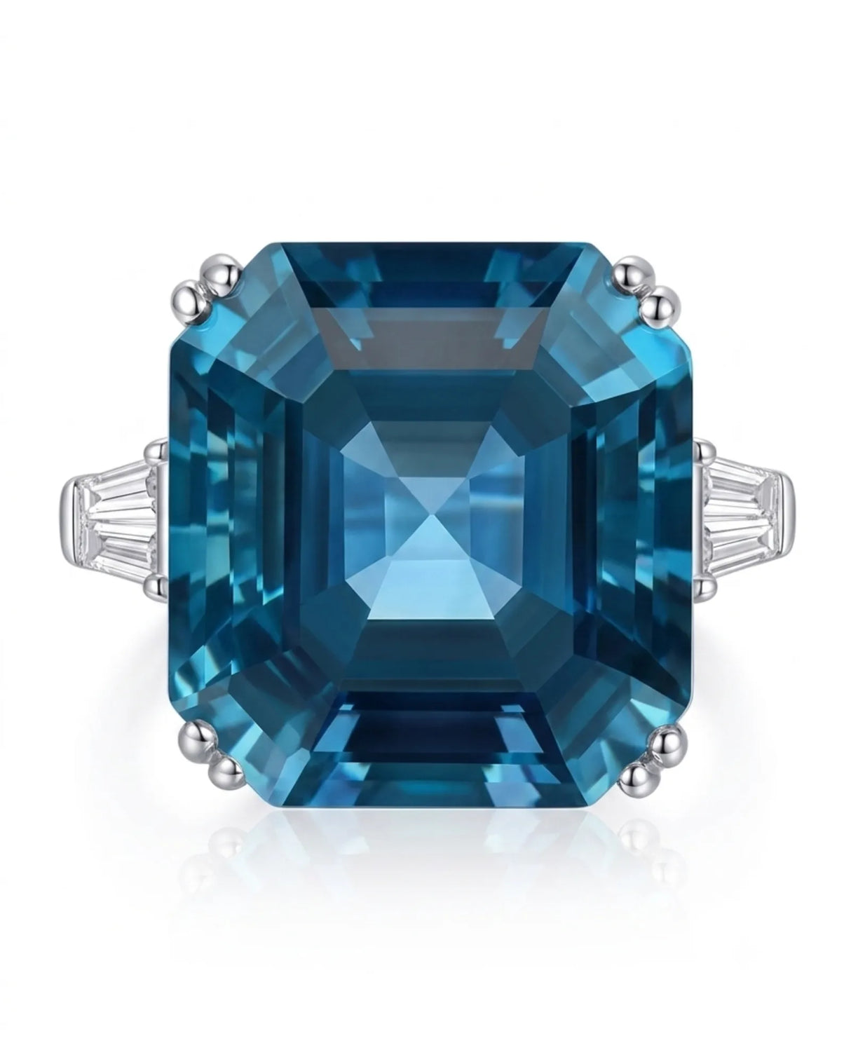 Deep blue Asscher topaz ring framed by geometric diamond accents in polished 18K white gold | SARATTI