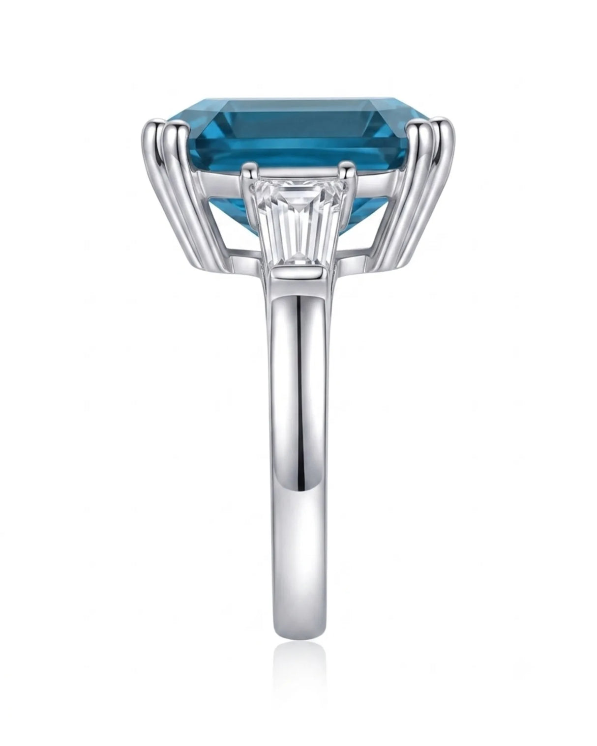 Deep blue Asscher topaz ring framed by tapered baguette diamonds in polished platinum | SARATTI