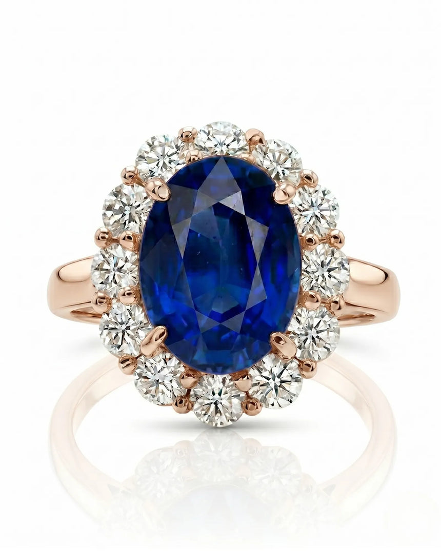 Deep blue oval sapphire ring with bright round diamonds in 18K rose gold | SARATTI
