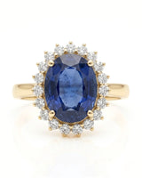 Deep blue oval sapphire ring with brilliant diamond frame in 18K yellow gold - SARATTI