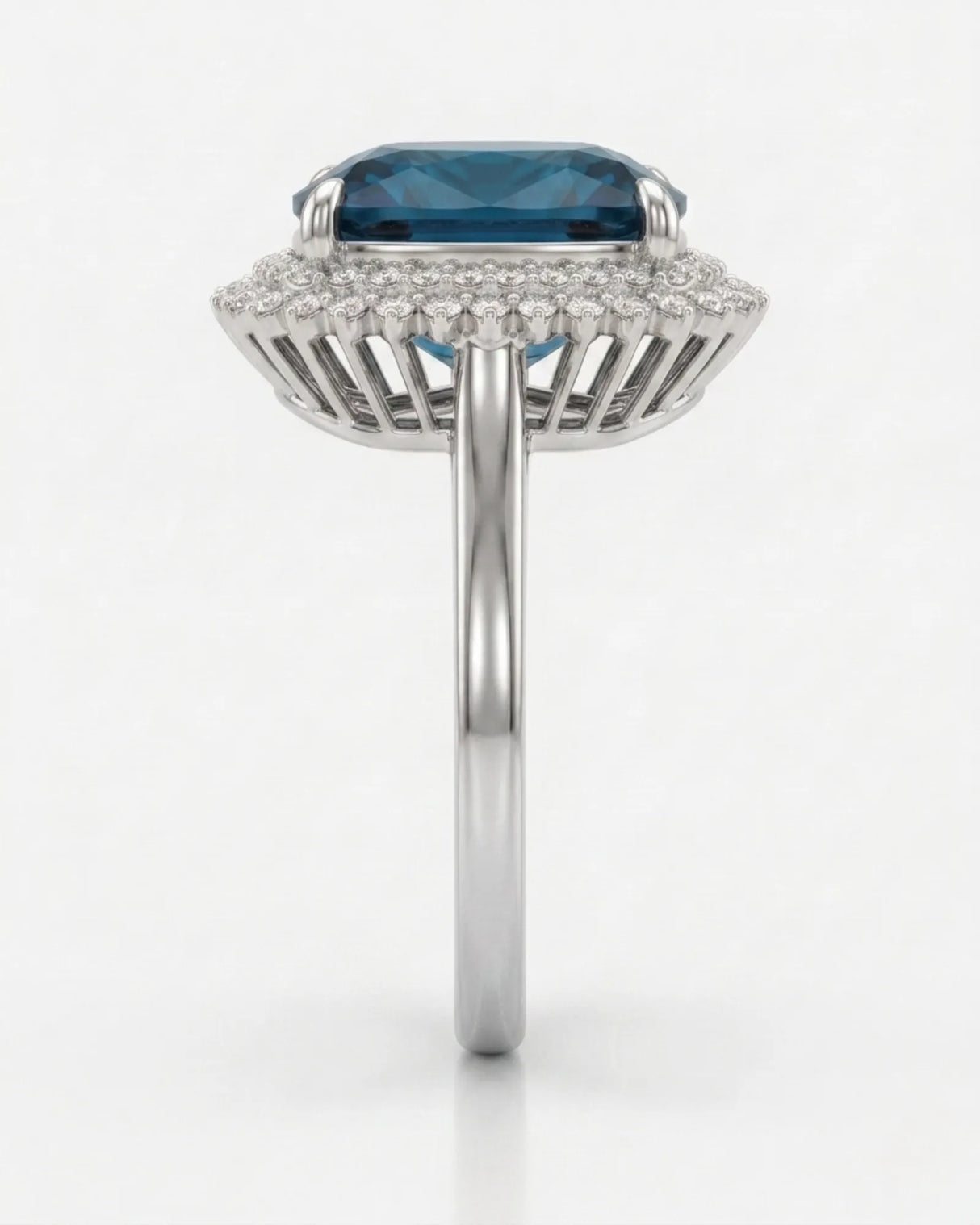 Deep blue tourmaline ring with sparkling diamond halo accents in a platinum design | SARATTI