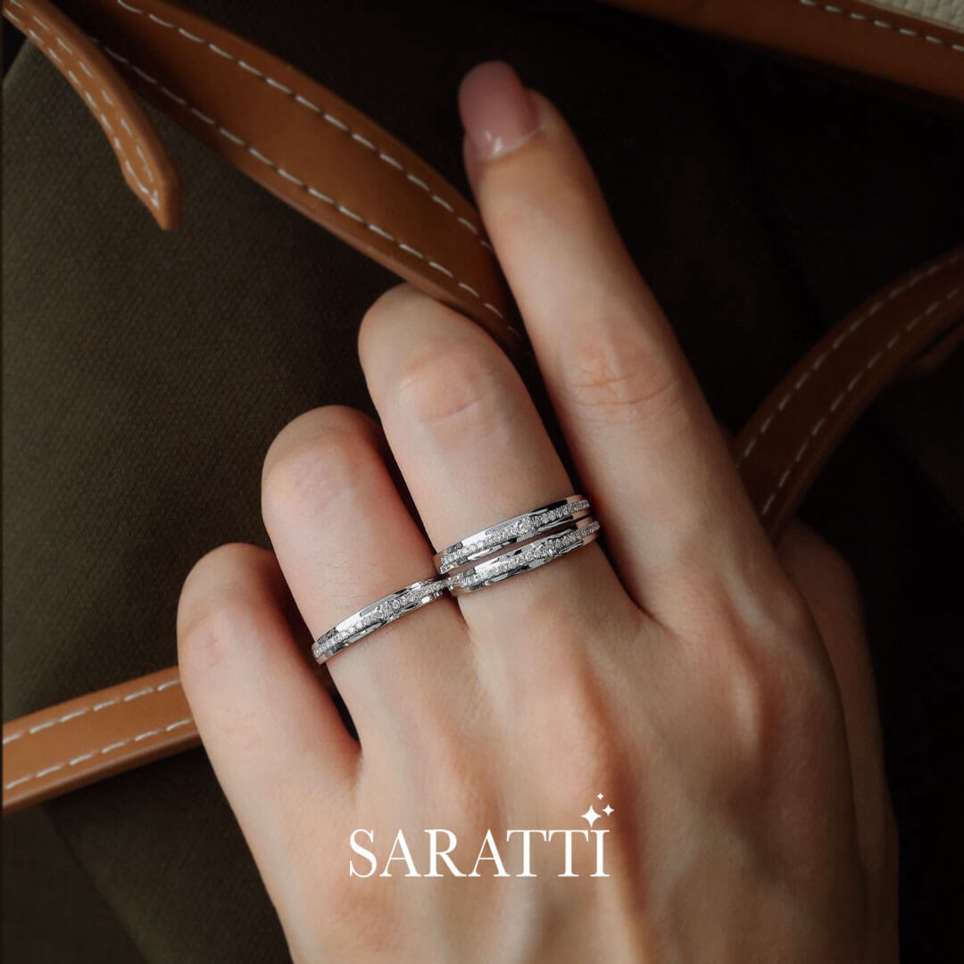 Model stacks three Channel Set Natural Diamond Eternity Wedding Bands in White Gold | Saratti