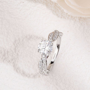 18K White Gold Prong Set Diamond Engagement Ring with a twist shank design | Saratti 