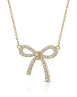 Diamond bow necklace with open ribbon loops and elongated tails in 18K yellow gold | SARATTI