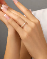 Diamond infinity band highlighting brilliant accent stones across a refined 18K yellow gold design | SARATTI