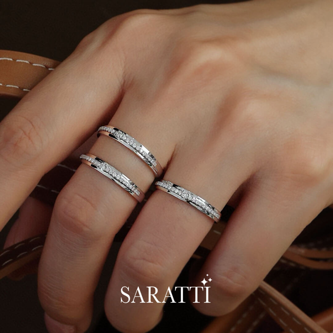 Close Up Shot of Channel Set Natural Diamond Eternity Wedding Bands on Model's Hand | Saratti