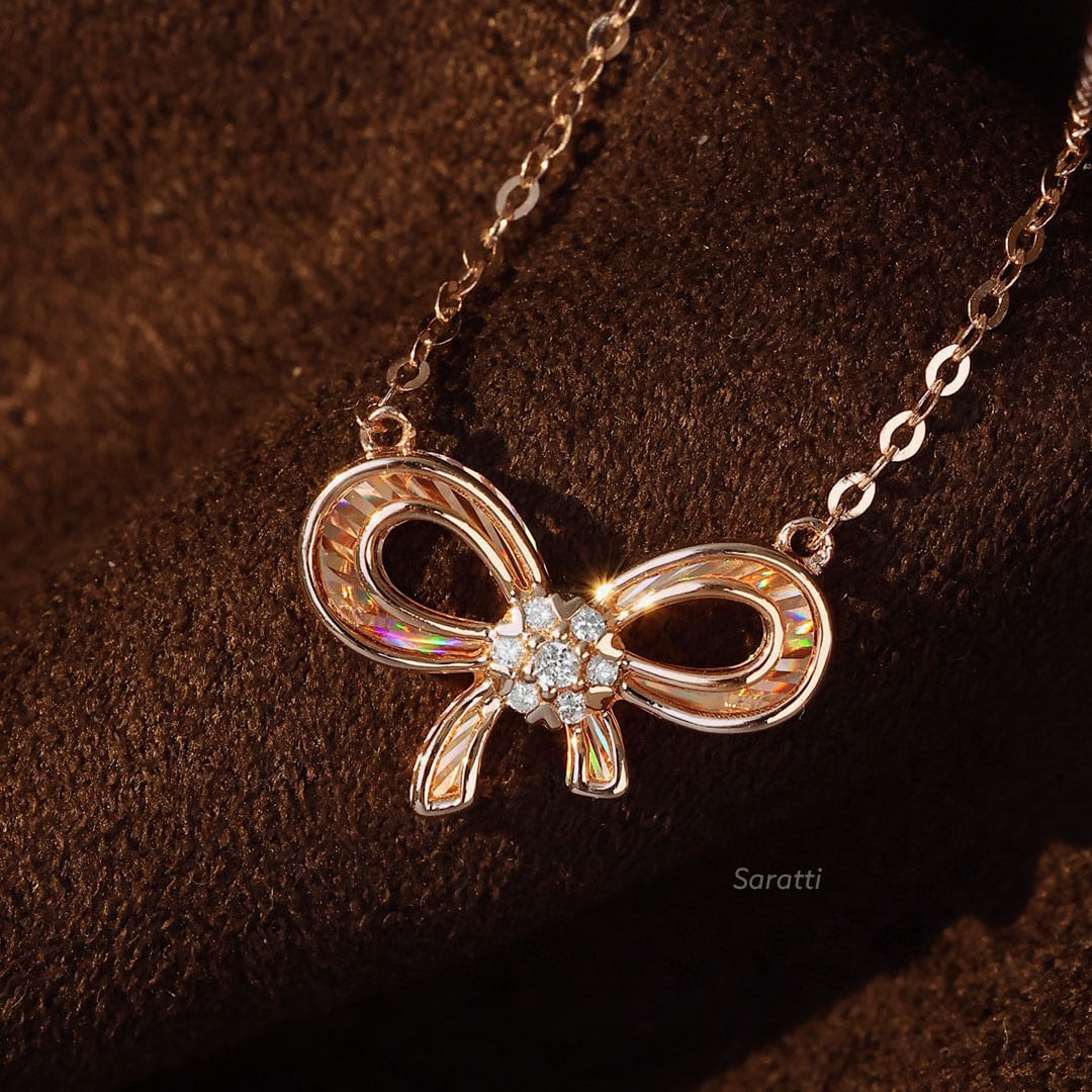 Close up of the Diamond Halo on the Ribbon Design Rose Gold Diamond Drop Necklace | Saratti