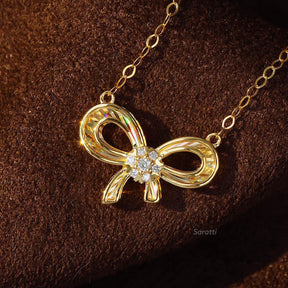 Close Up of the Diamond Halo in the Ribbon Design Yellow Gold Diamond Drop Necklace | Saratti