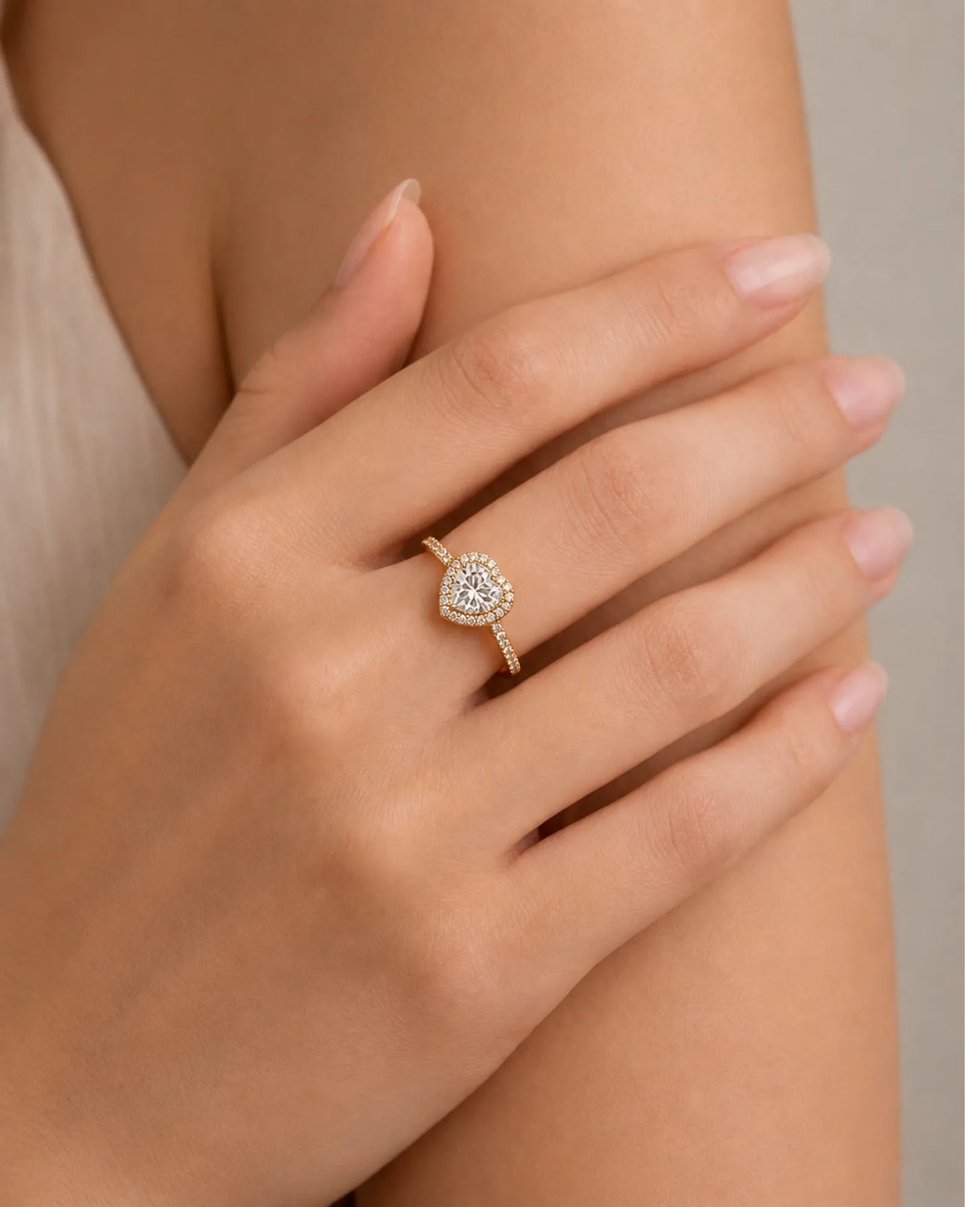 Double-heart moissanite ring with sculpted halo and open gallery in warm 18K yellow gold | SARATTI