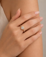 Double-heart moissanite ring with sculpted halo and open gallery in warm 18K yellow gold | SARATTI