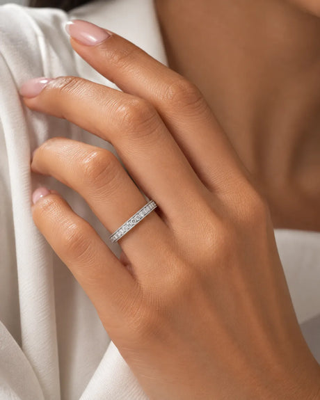Milgrain diamond wedding band in 18K white gold worn on hand | SARATTI