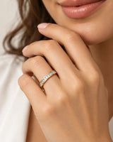 Princess-cut diamond wedding band in 18K yellow gold styled on a model | SARATTI