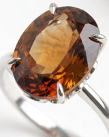 Elegant Imperial Topaz engagement ring featuring an oval center and refined polished platinum band | SARATTI