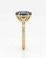 Elegant blue moissanite engagement ring for a distinctive proposal in yellow gold | SARATTI