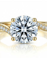 Elegant diamond engagement ring with pavé side diamonds and warm 18K yellow gold setting | SARATTI